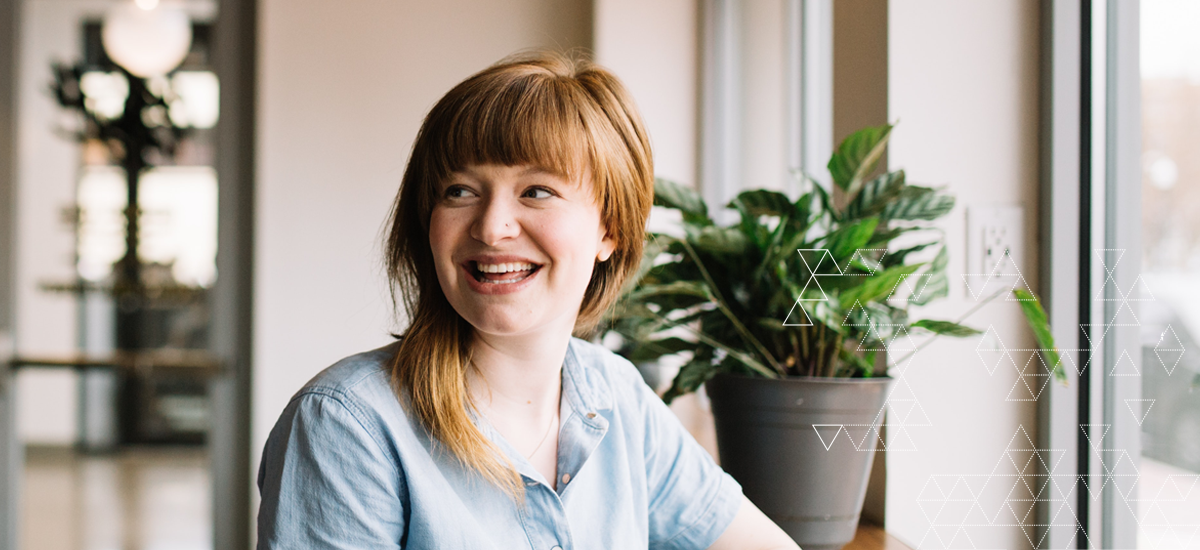 Woman looking to right and smiling